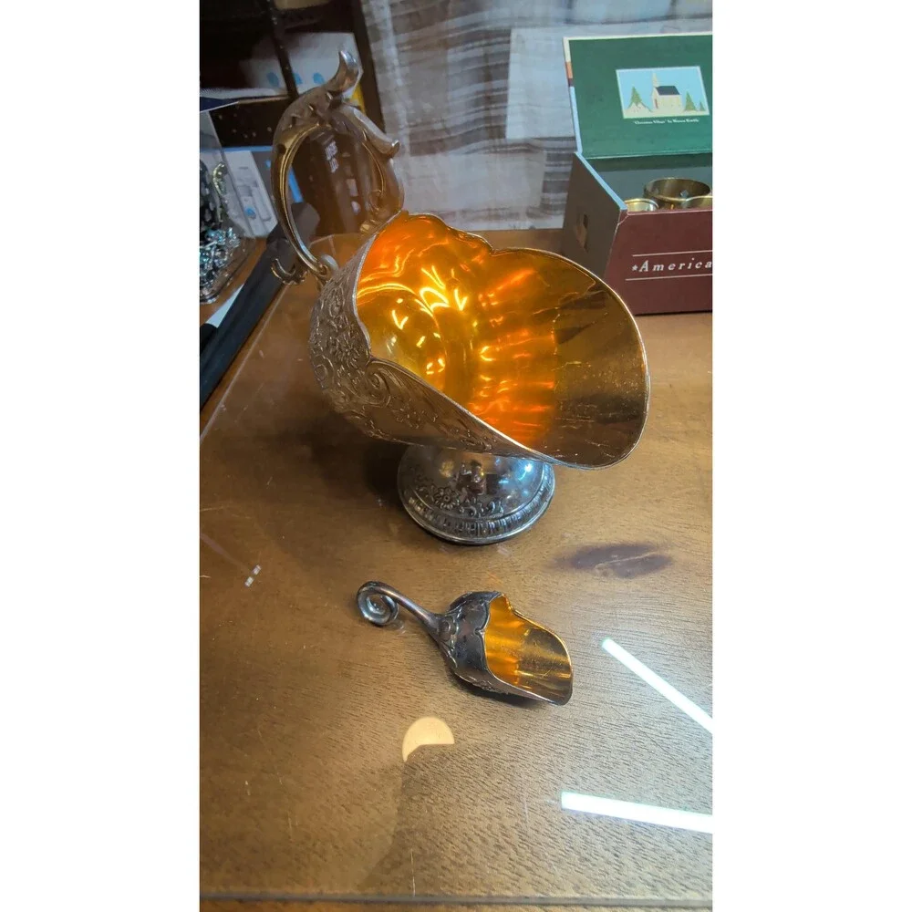 vintage silver-plated sugar scuttle with a matching mini scoop